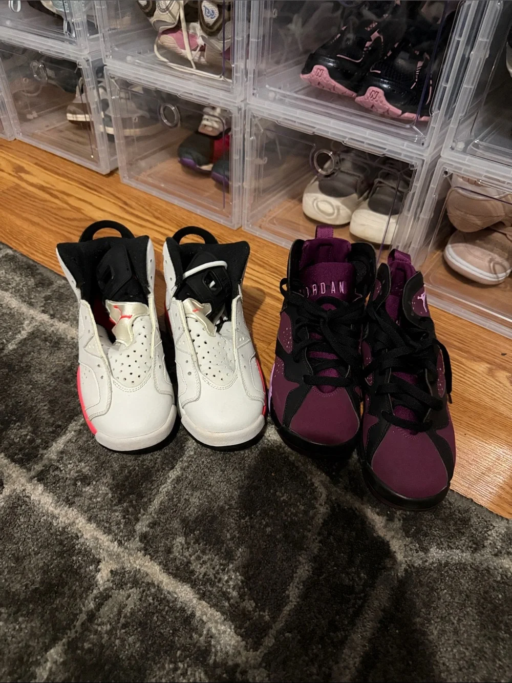Two pair Jordan Kids Sneakers in White with Pink Accents & Purple with Black